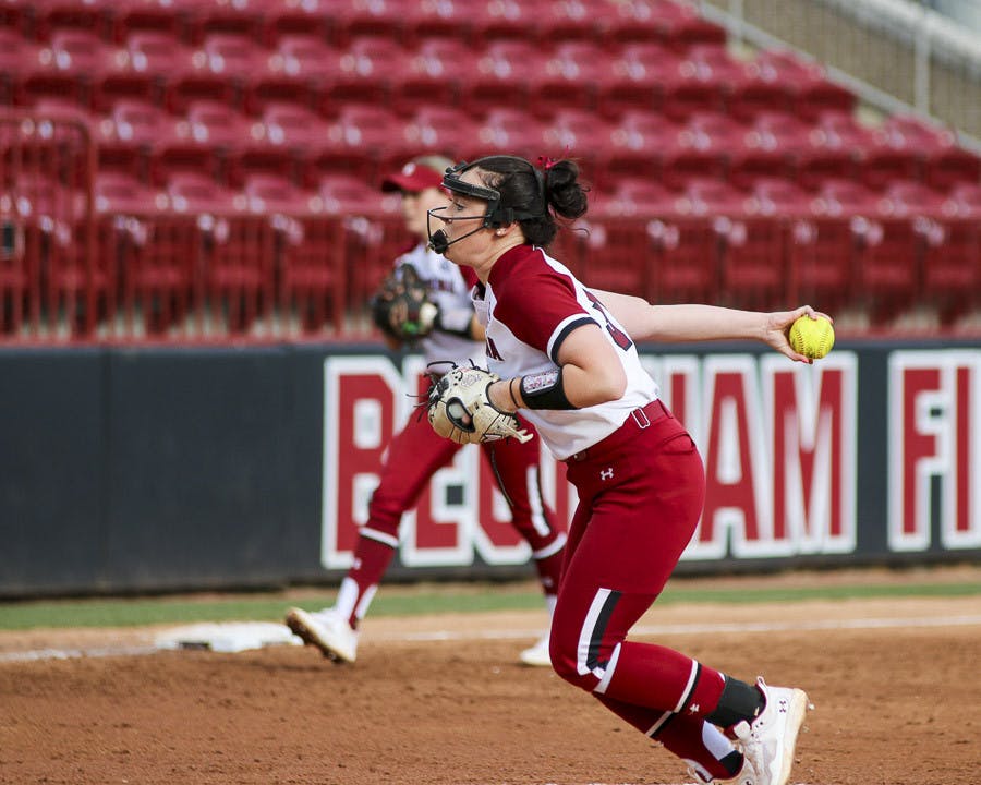 Senior pitcher Karsen Ochs winds up for a pitch during the match against Western Kentucky University at Beckham Field on Feb. 19, 2023. The Gamecocks beat the Hilltoppers 11-2.