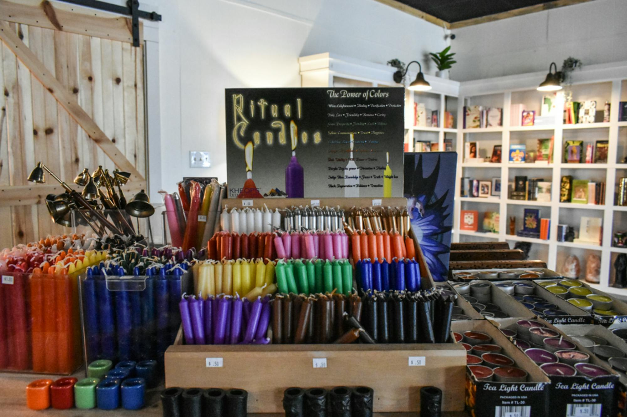 Ritual candles of all sorts of colors line a table in The Healing Bar on Jan. 26, 2023. Each color of candle is used for a different, specific purpose.