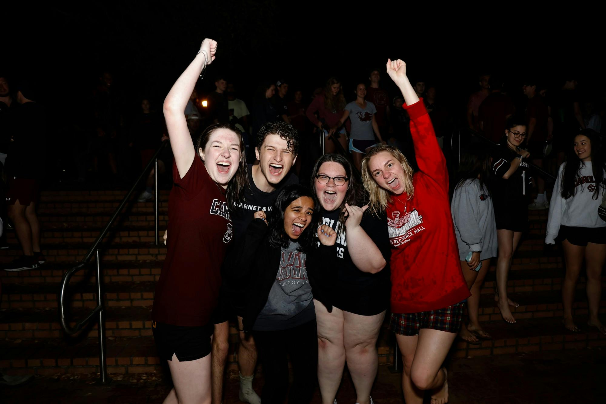 South Carolina students cheer next to the fountain in support of the women’s basketball team. 