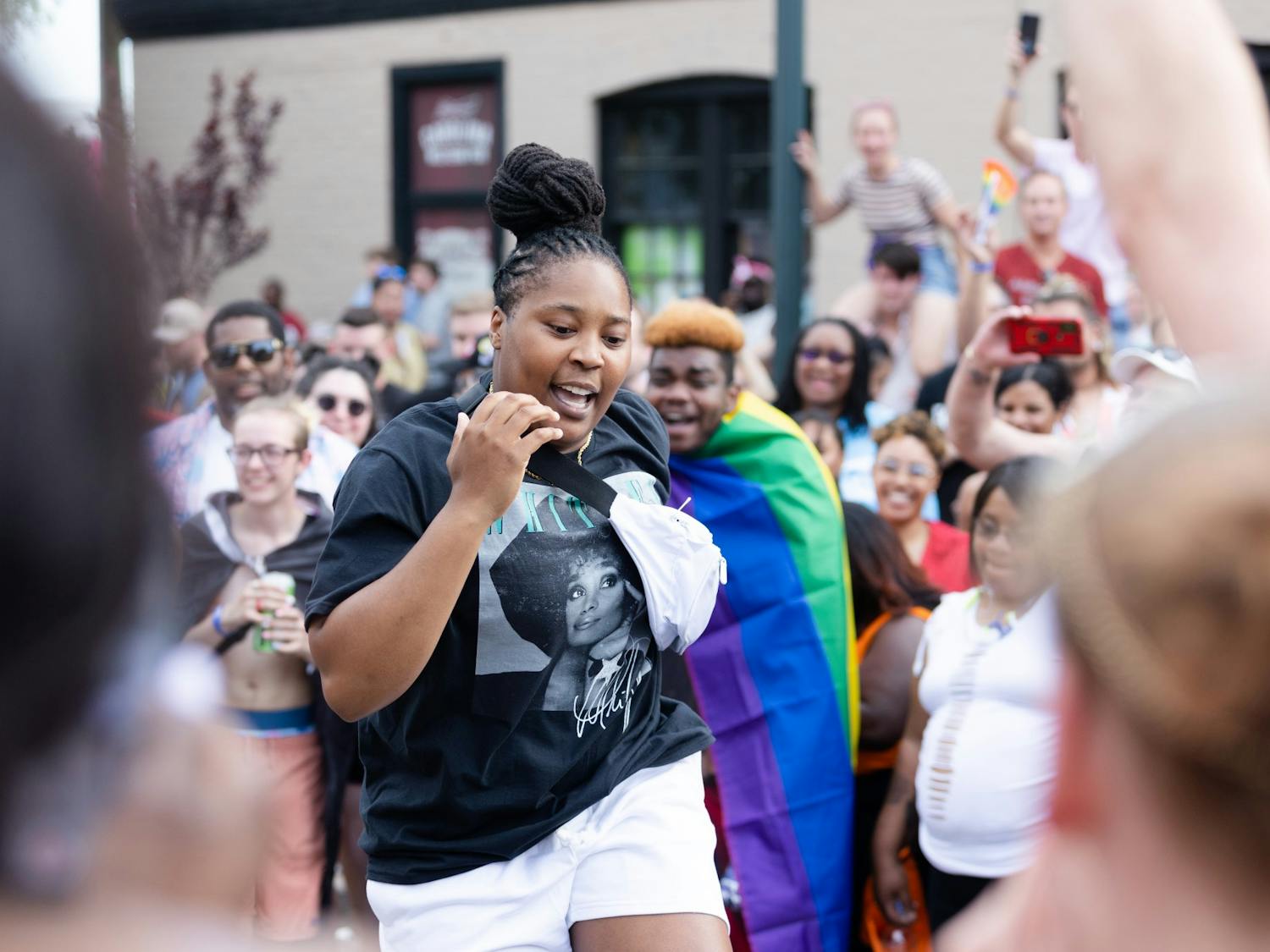 An Outfest attendee shows off their moves as a dance circle breaks out on Park Street on June 4, 2022. Outfest featured performances, food and vendors in honor of Pride month.