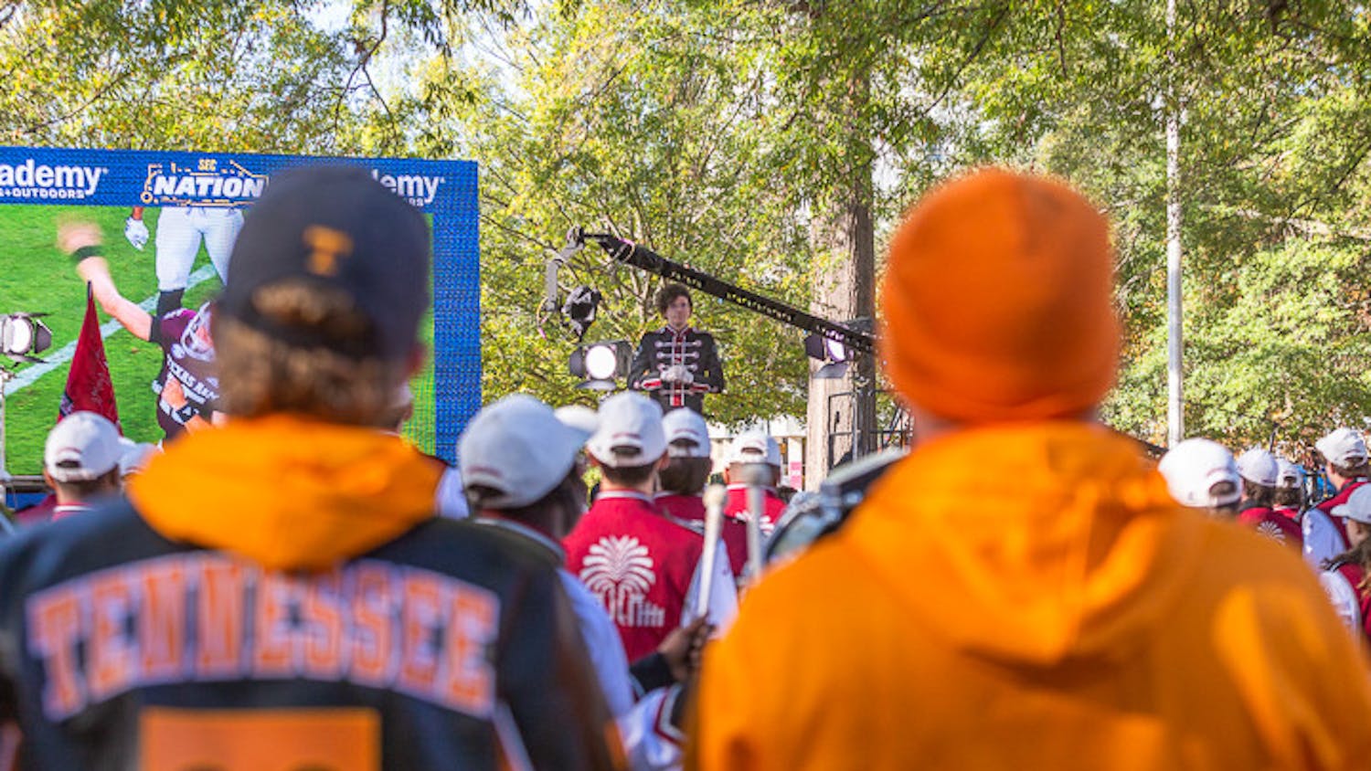 Two Tennessee fans watch as the South Carolina band performs during the SEC Nation pregame show on USC's Horseshoe on Nov. 19, 2022. Fans from across South Carolina and Tenessee came down to attend the event.
