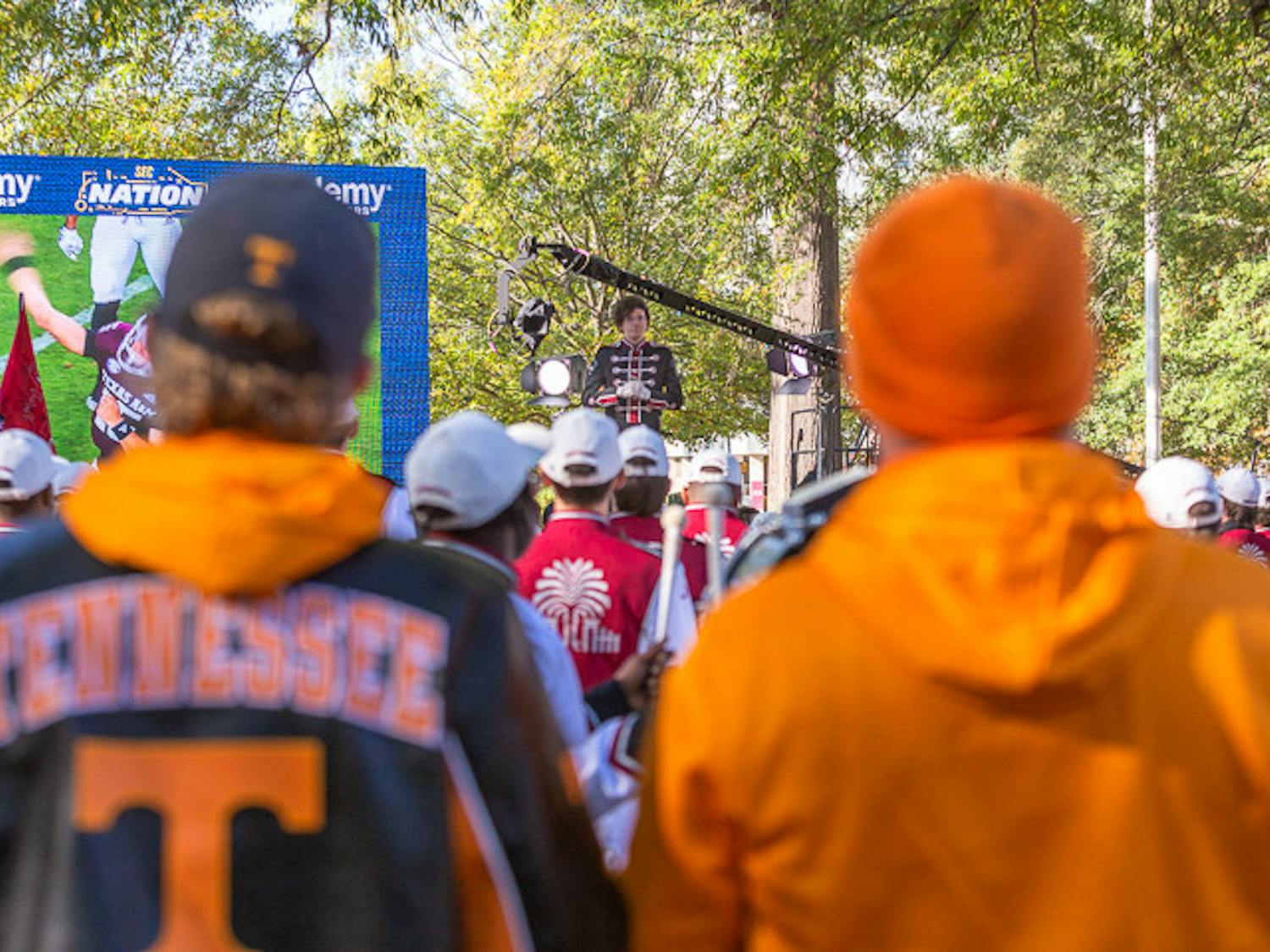Two Tennessee fans watch as the South Carolina band performs during the SEC Nation pregame show on USC's Horseshoe on Nov. 19, 2022. Fans from across South Carolina and Tenessee came down to attend the event.