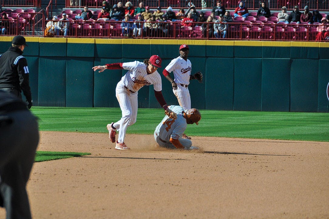 Junior infielder Braylen Wimmer attempts to catch Texas stealing second base on March 12, 2022. The Gamecocks beat the Longhorns, 3-2, during the series.