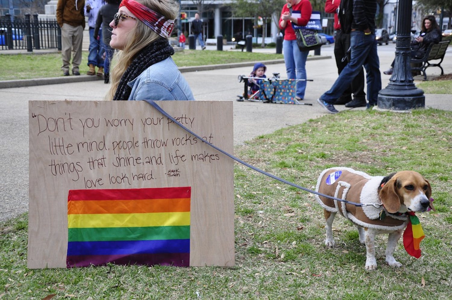 People and pets display the rainbow symbol in support of the LGBT community at the United for Marriage Equality Rally at the Statehouse.