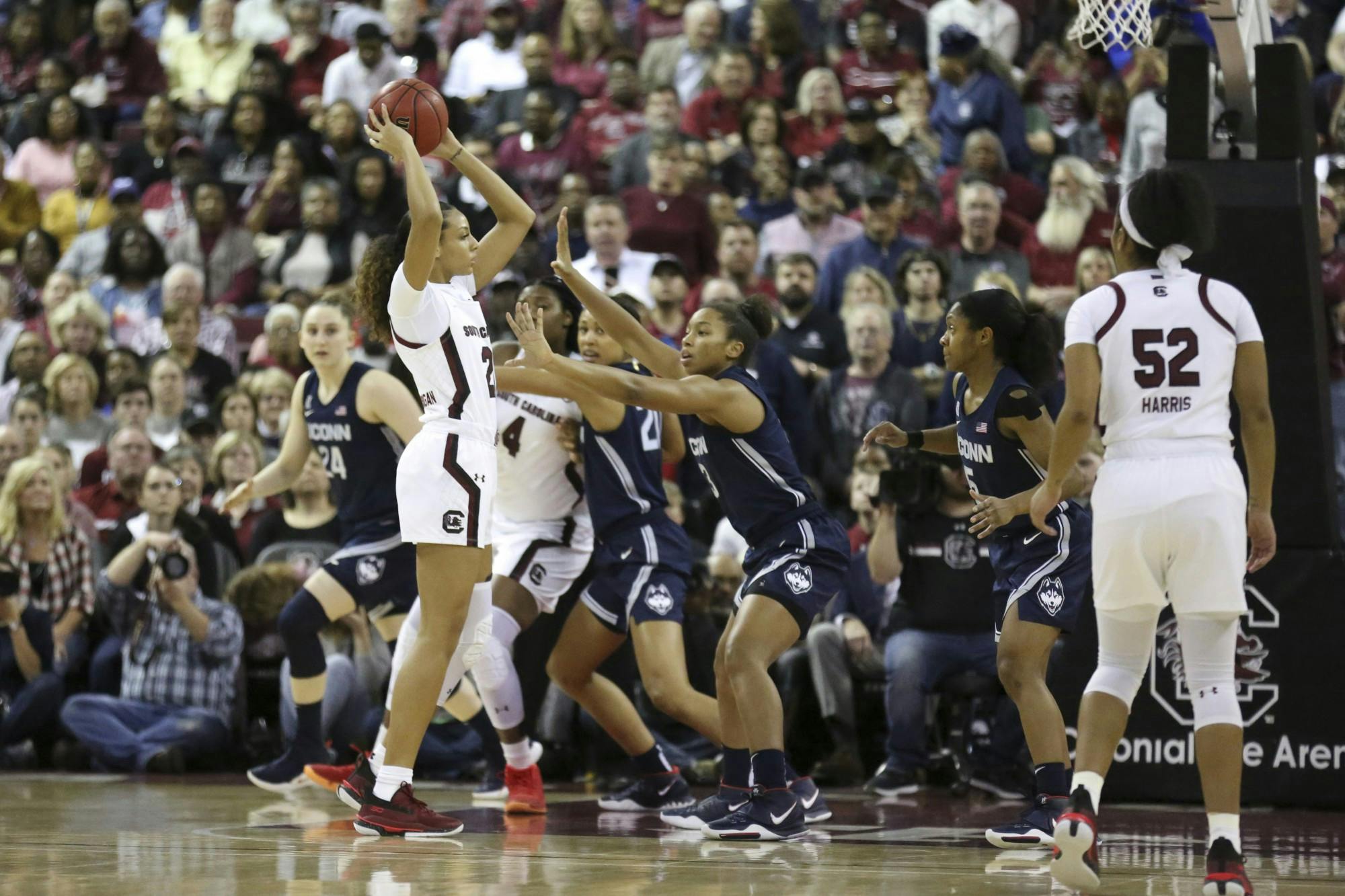 Senior forward Mikiah Herbert Harrigan looks to find an open teammate while playing UConn Feb. 10. Herbert Harrigan scored 10 points in the game against the Huskies.