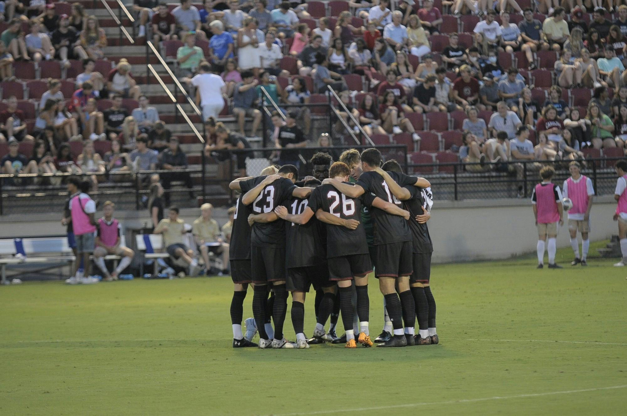 South Carolina men's soccer team huddle in a group.&nbsp;