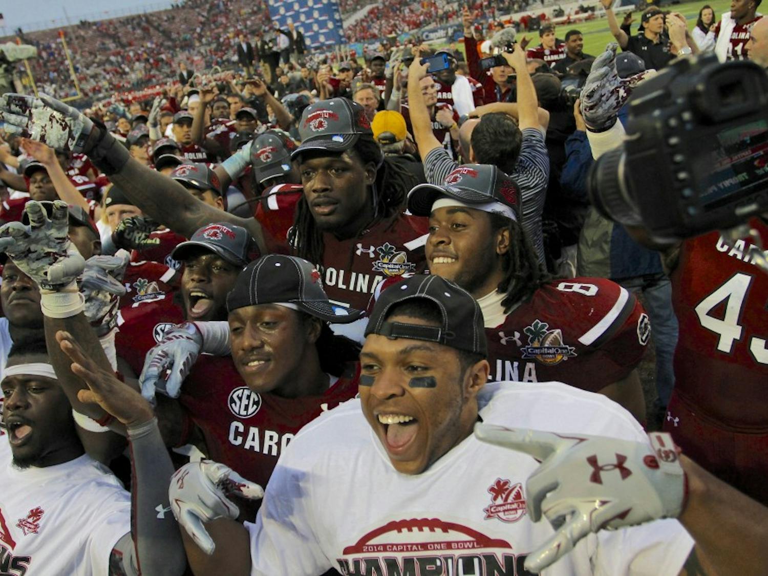 	Junior defensive end Jadeveon Clowney poses with teammates after the Gamecocks beat the Wisconsin Badgers 34-24 at the Capital One Bowl on Jan. 1.
