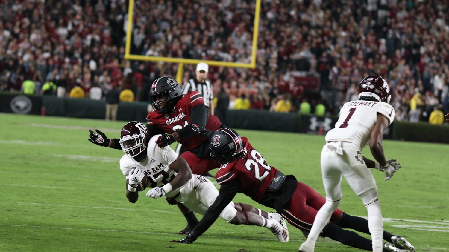 Junior defensive lineman Tonka Hemingway and redshirt senior defensive back Darius Rush get the tackle during the fourth quarter against Texas A&M at Williams-Brice Stadium on Oct. 22, 2022. The Aggies lost to the Gamecocks 30-24.