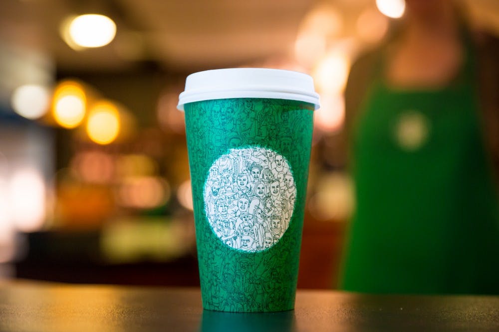 The illustration on the green Starbucks cup was drawn in one continuous stroke.