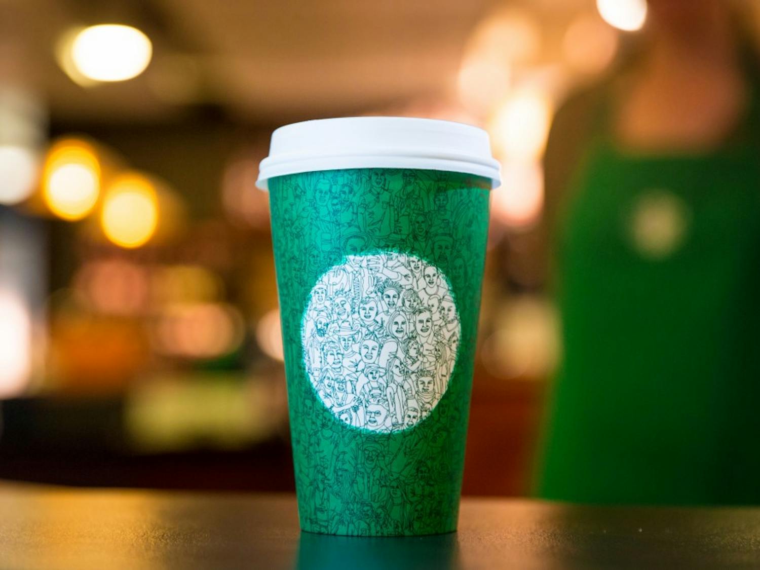 The illustration on the green Starbucks cup was drawn in one continuous stroke.