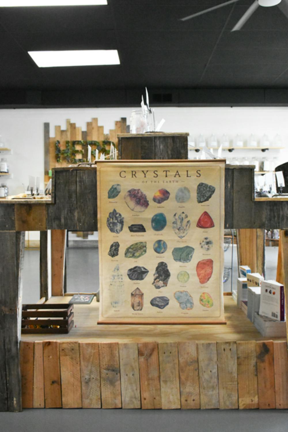 <p>A crystal chart hangs next to The Healing Bar's collection of stones and gems, telling customers the names of the crystals they are browsing. The crystals of the Earth are listed on the chart.</p>