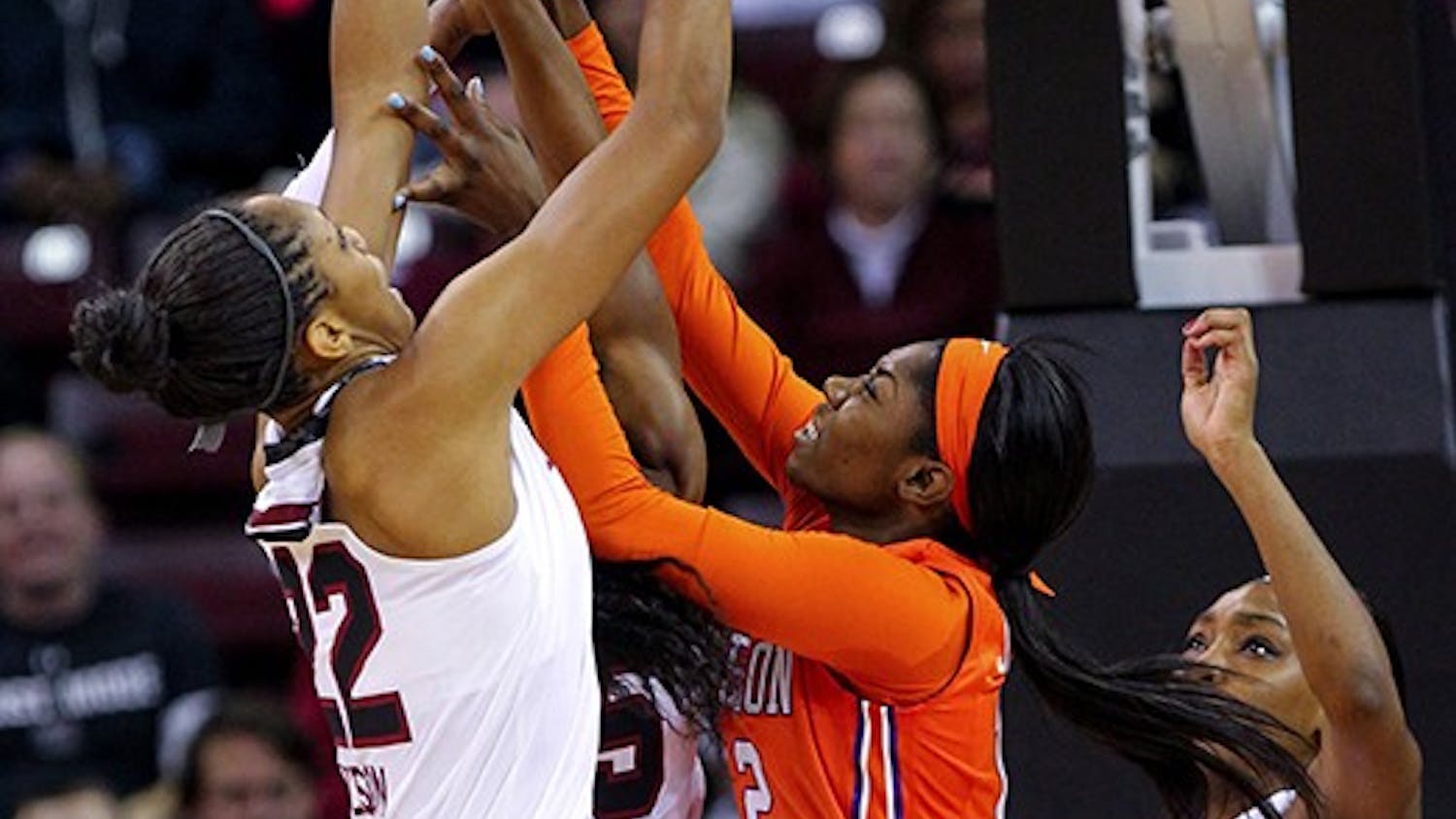 South Carolina&apos;s A&apos;ja Wilson (22) brings down a rebound against Clemson&apos;s MaKayla Johnson (12) during the first half at the Colonial Life Arena in Columbia, S.C., on Thursday, Nov. 20, 2014. (Tracy Glantz/The State/TNS)