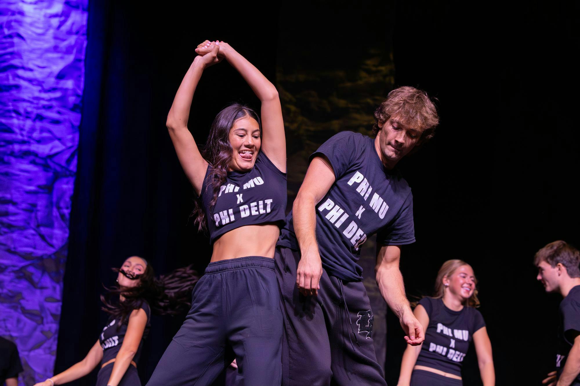 Dancers from Phi Mu and Phi Delta Theta bump hips during their performance for Spurs &amp; Struts at the Columbia Metropolitan Convention Center on Oct. 22, 2025. Spurs &amp; Struts is hosted annually by the Homecoming Board and Gamecock Entertainment.