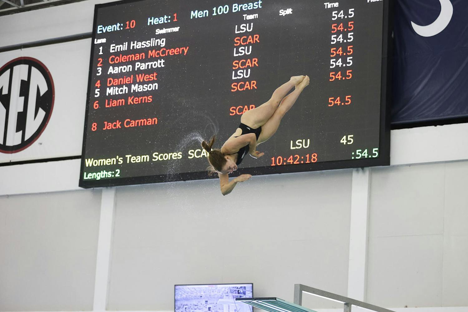 Graduate diver Brooke Schultz does a twisting dive off of the board duirng the meet against LSU at Carolina Natatorium on Oct. 8, 2022. Shultz made placed first in one-meter and three-meter finals at the SEC Swimming and Diving Championship in College Station, Texas, from Feb. 14-18, 2023.&nbsp;