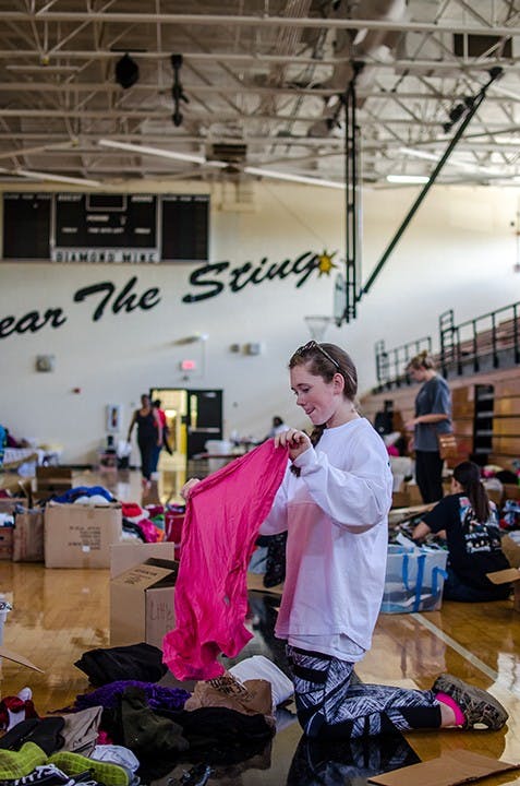 Lower Richland High School Red Cross volunteer sorts through clothes donation on October 6. 