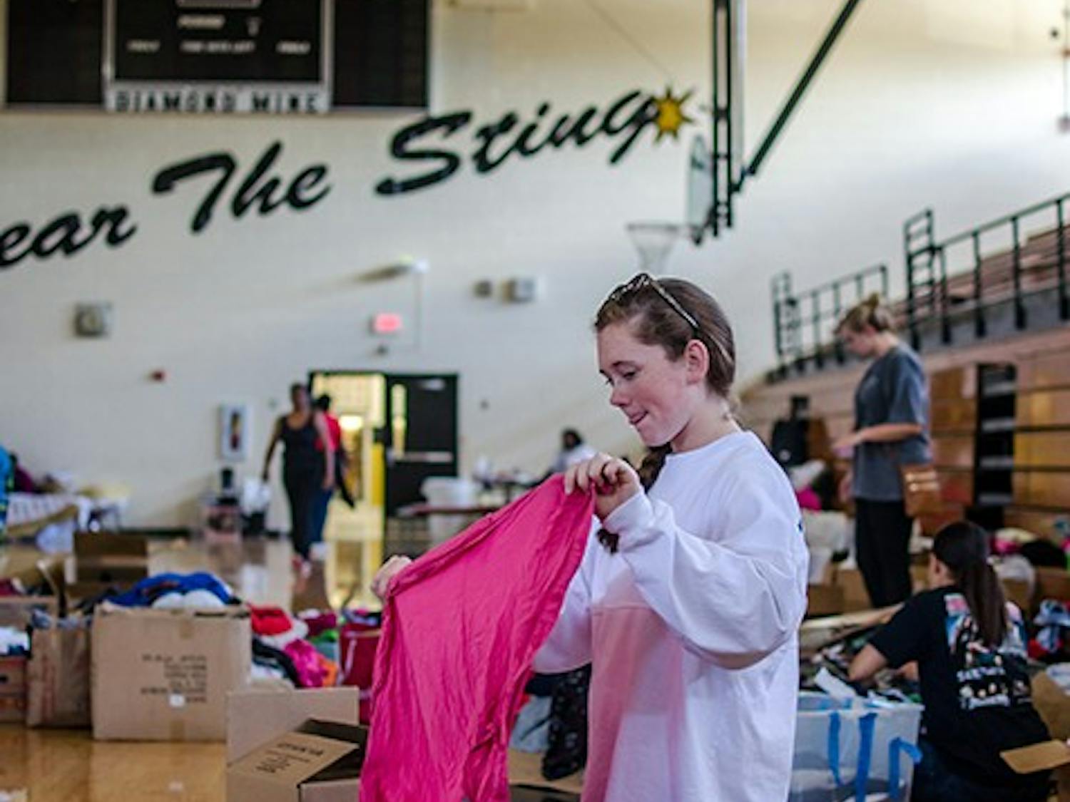 Lower Richland High School Red Cross volunteer sorts through clothes donation on October 6. 