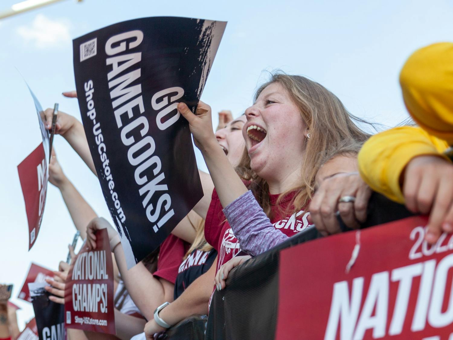 South Carolina fans wave signs at Colonial Life Arena in Columbia, SC on April 4, 2022. The outside of the arena was crowded with fans supporting the women's basketball team.