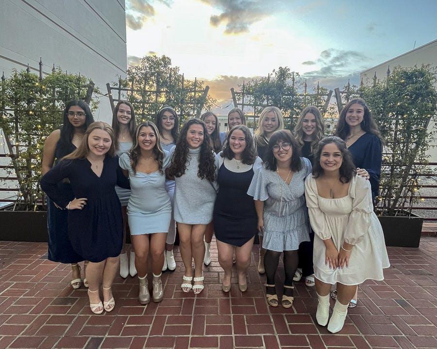 Members of The Cocktails pose outside of the Koger Center for the Arts after their winter recital on Dec. 2, 2022. The all-female a capella group is organized and ran by students who perform live events around Columbia and release their content online.
