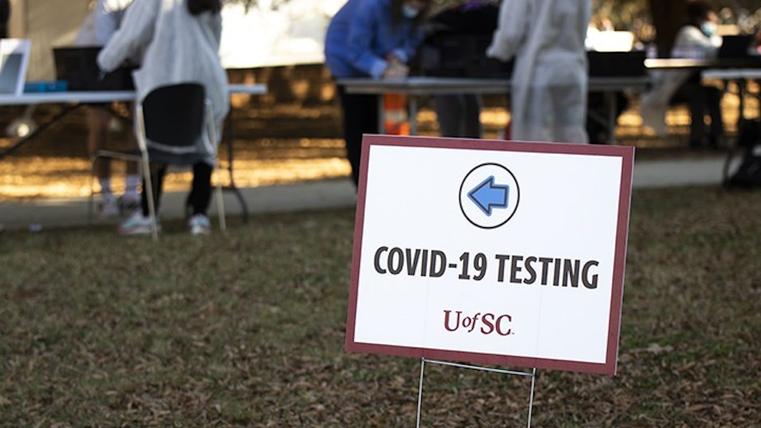 A sign marks the check-in area for COVID-19 testing on Davis Field.&nbsp;