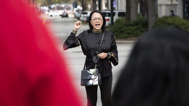 Junlan Lei passionately speaks to the crowd about violence in the United States.
