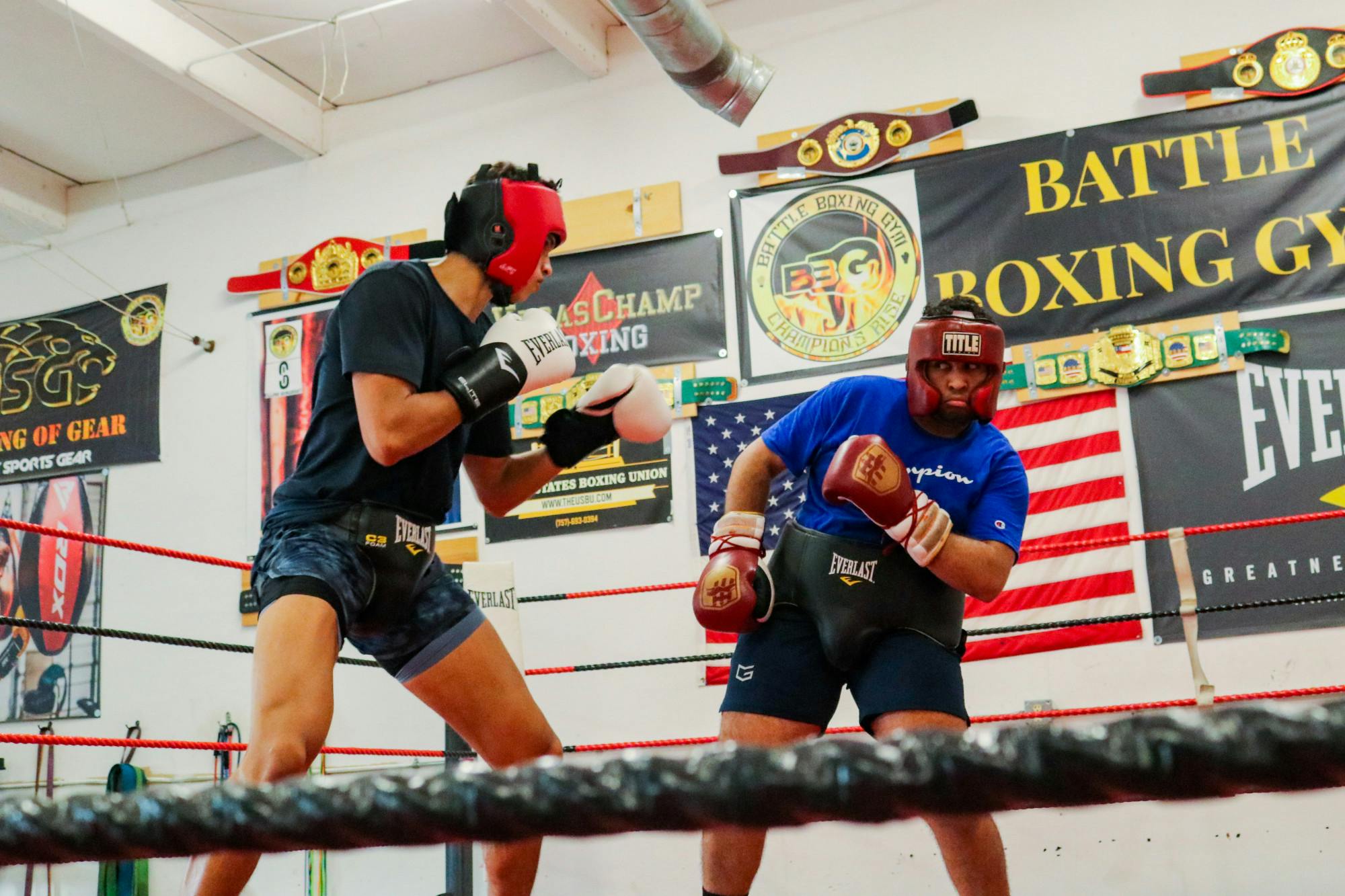 Carolina Boxing Club veteran David Trav (right) spars in the ring during a practice on Sept. 12, 2022, at the Battle Boxing Gym in Columbia, S.C.