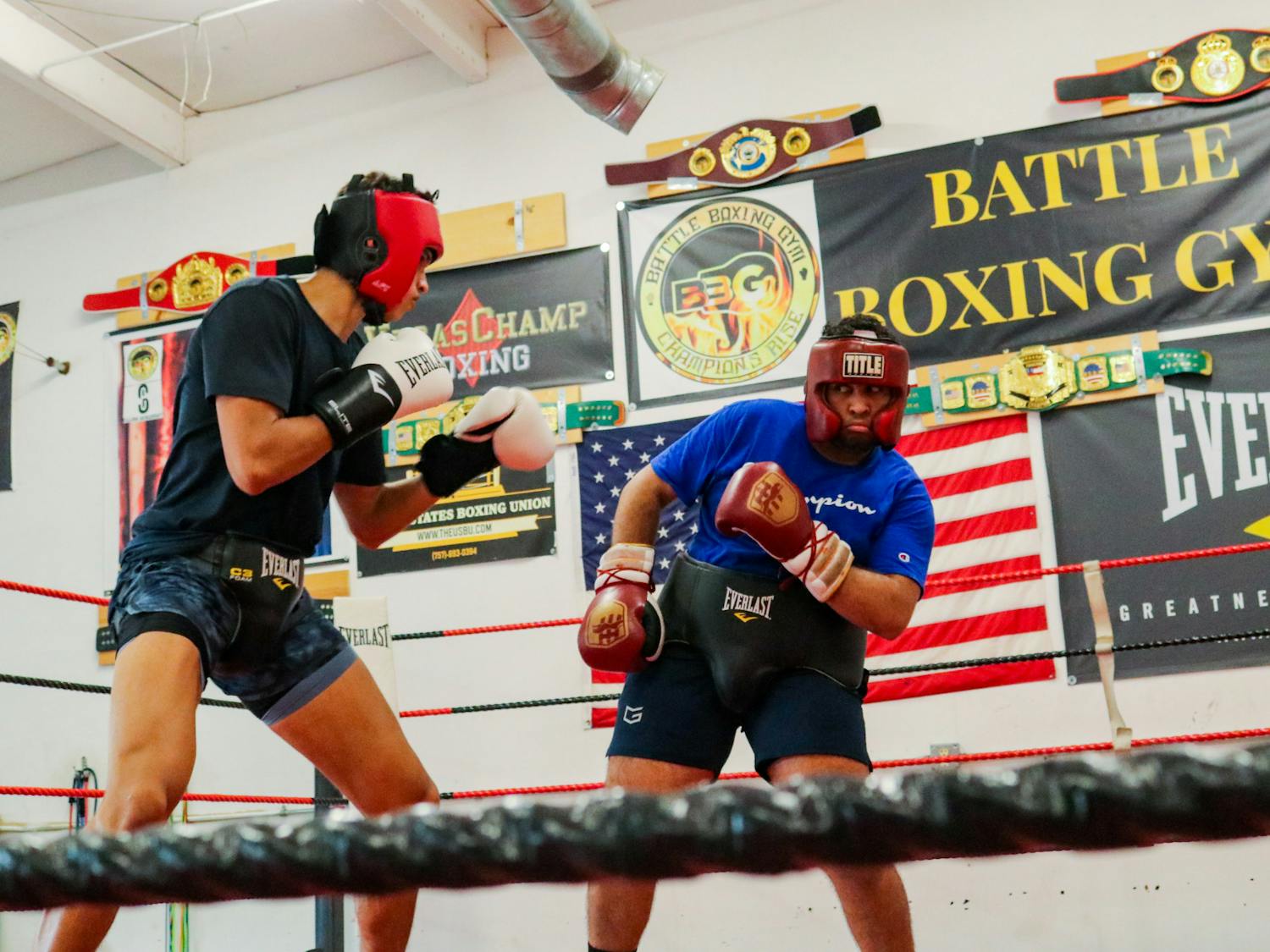 Carolina Boxing Club veteran David Trav (right) spars in the ring during a practice on Sept. 12, 2022, at the Battle Boxing Gym in Columbia, S.C.