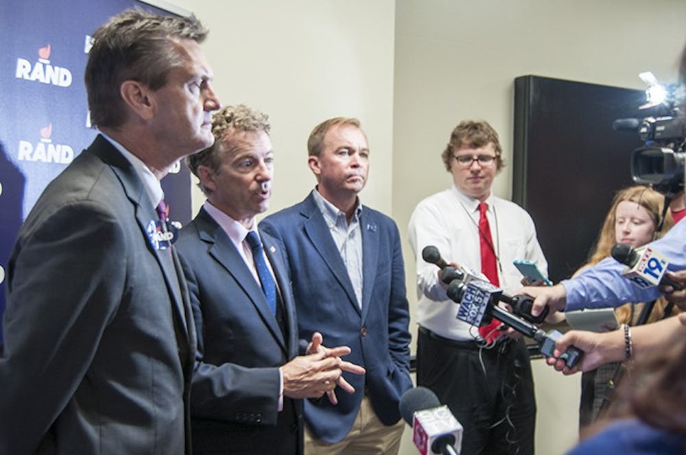 <p>From left: South Carolina State Sen. Tom Davis, Kentucky Sen. Rand Paul and Rep. Mick Mulvaney. Republican presidential candidate Rand Paul addressed local media at the Russell House University Union before speaking to students. </p>