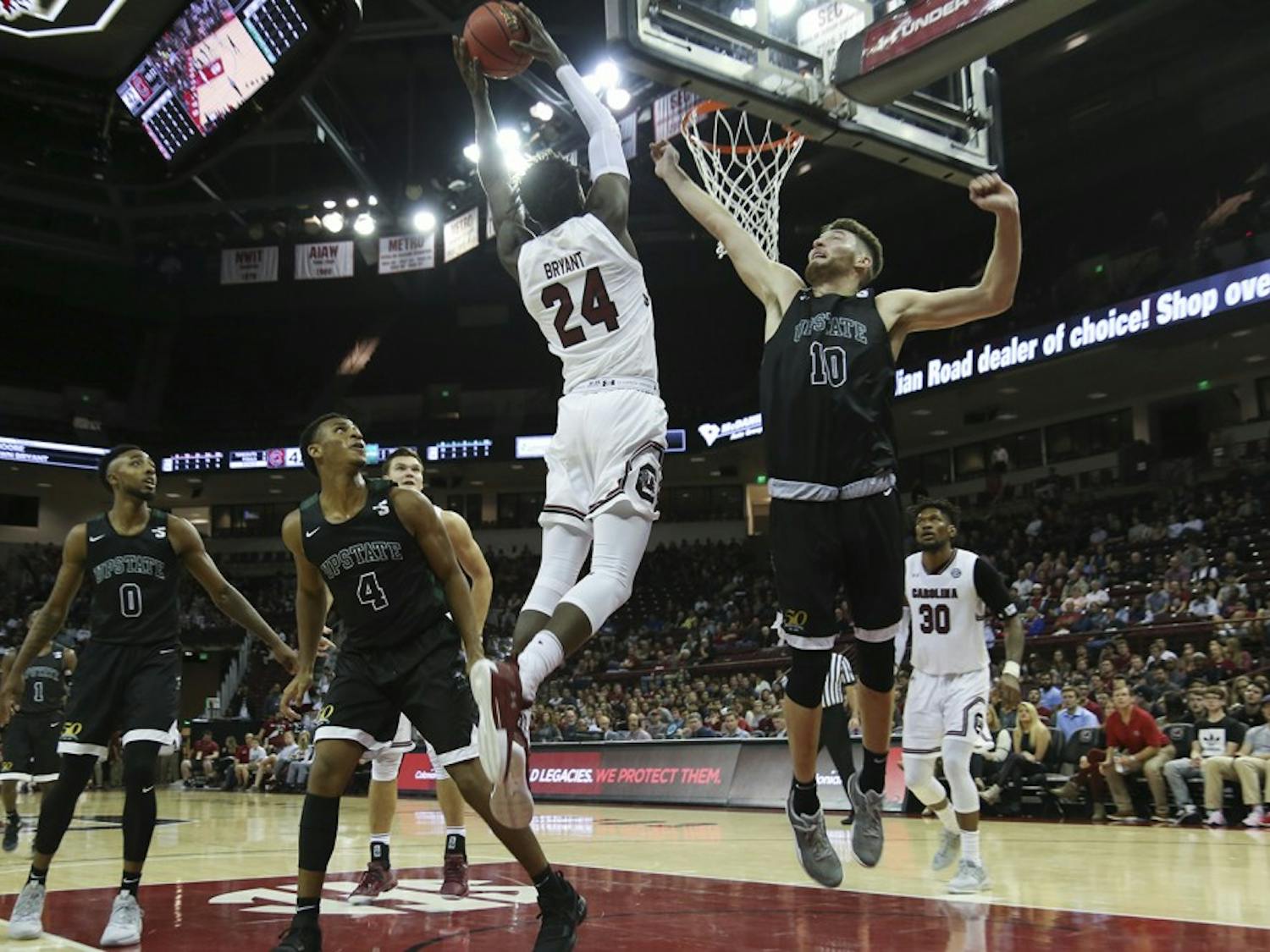 Senior Keyshawn Bryant jumps for a layup. Bryant is one of the returning players on the team, who will be playing alongside 9 new members of the mens basketball team this season. 