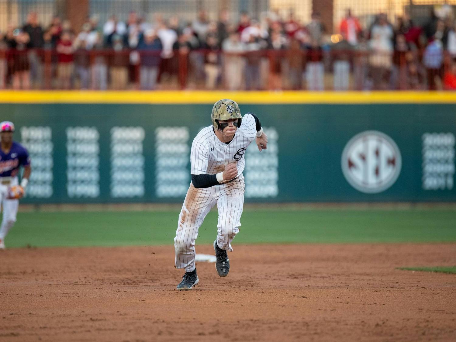 Senior outfielder Dalton Mashore runs to third base on March 2, 2025 as the Gamecocks face off against the Clemson Tigers in the last game of their Palmetto Series rivalry. The three games with three different locations had a total attendance of 22,116.