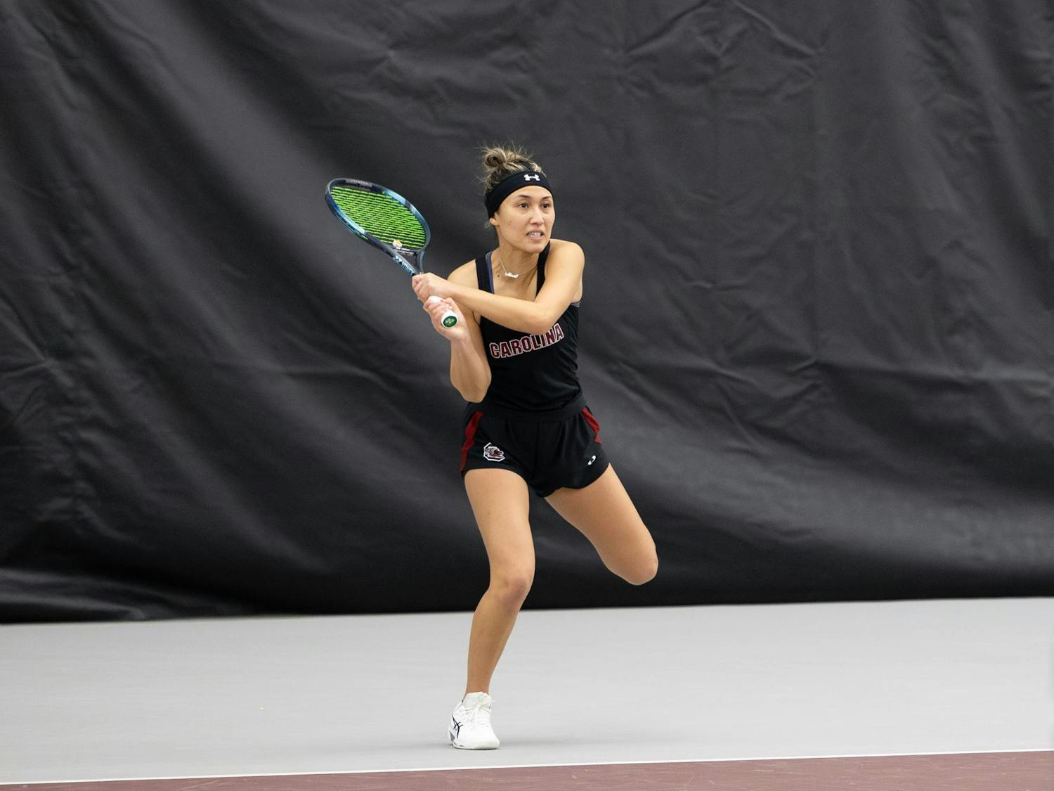 Gamecock junior Misa Malkin takes her stance to forehand the ball against the Chanticleers. Malkin and her teammate junior Sarah Hamner won 6-3 in their doubles set against Coastal Carolina on Jan. 21, 2024, at the Carolina Indoor Tennis Center.&nbsp;