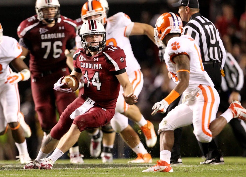 Quarterback Connor Shaw of South Carolina scrambles for a gain against Clemson on Saturday, November 26, 2011, in Columbia, South Carolina. (C. Aluka Berry/The State/MCT)