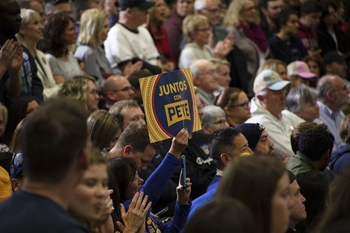 Volunteers and attendees hold up Pete Buttigieg propaganda before and during the forum. Multiple volunteers began and led chants before the forum started.