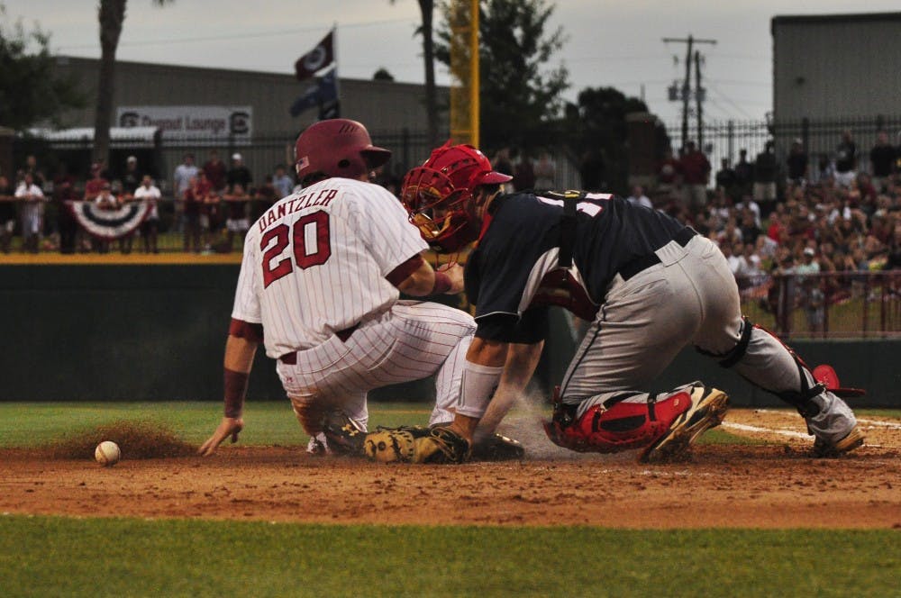 	Gamecocks infielder LB Dantzer slides into home plate Sunday night.