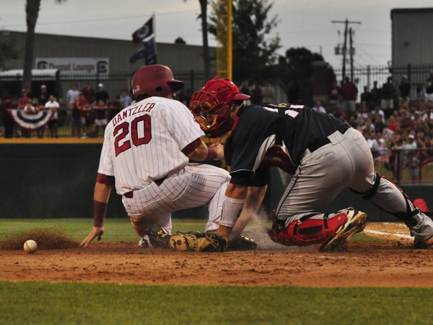 Gamecocks infielder LB Dantzer slides into home plate Sunday night.