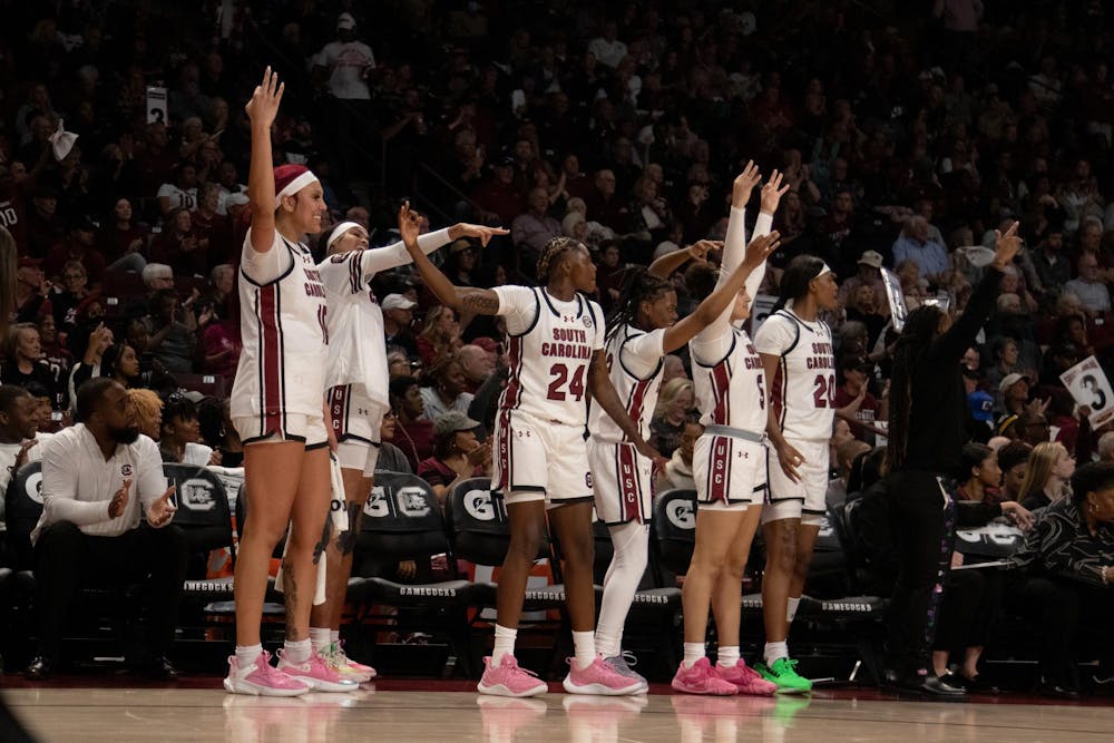 <p>FILE — Members of the South Carolina women's basketball team celebrate a 3-pointer shot during its game against Maryland on Nov. 12, 2023. The Gamecocks defeated the Testudos 114-76, and the team is currently undefeated.</p>