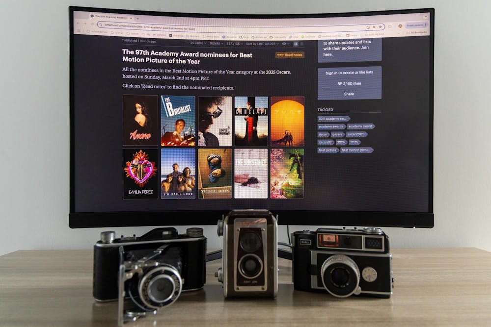 <p>A monitor showing the Oscar nominees for Best Motion Picture of the Year sits on a desk with vintage cameras. The 97th Academy Awards will be broadcasted on March 2, 2025 at 7 p.m. EST.</p>