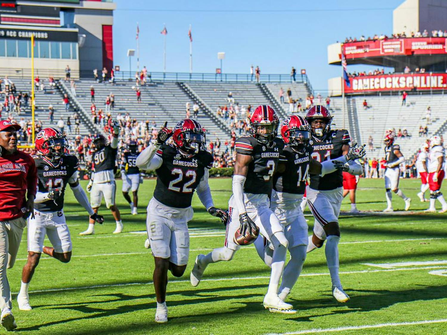 Redshirt junior defensive back O'Donnell Fortune (center) runs to the end zone with several other players after a successful turnover in the fourth quarter of the matchup between the South Carolina and Jacksonville State Gamecocks on Nov. 4, 2023. The overturn helped South Carolina win the game against Jacksonville State.