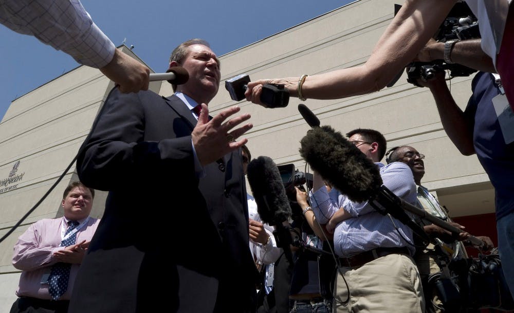 Reporters get a sound bite from former Virginia governor Jim Gilmore as he enters the Koger Center at the University of South Carolina in Columbia, South Carolina, Tuesday, May 15, 2007. Gilmore was on hand for a walkthrough prior to a televised Republican Presidential debate. (Gary O'Brien/Charlotte Observer/MCT)
