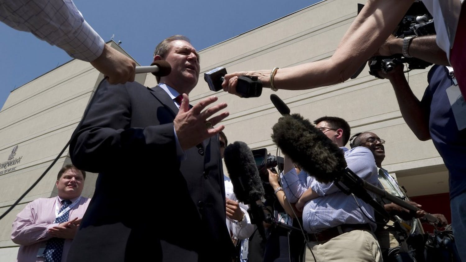 Reporters get a sound bite from former Virginia governor Jim Gilmore as he enters the Koger Center at the University of South Carolina in Columbia, South Carolina, Tuesday, May 15, 2007. Gilmore was on hand for a walkthrough prior to a televised Republican Presidential debate. (Gary O'Brien/Charlotte Observer/MCT)