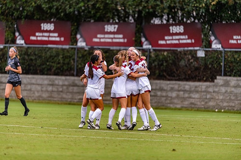 <p>Members of the South Carolina women's soccer team celebrate after a goal in the win against Missouri. The win was the first of the season for the Gamecocks.</p>