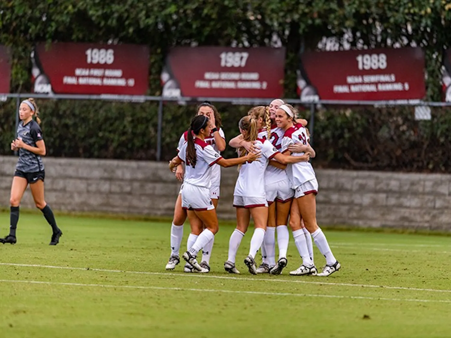 Members of the South Carolina women's soccer team celebrate after a goal in the win against Missouri. The win was the first of the season for the Gamecocks.