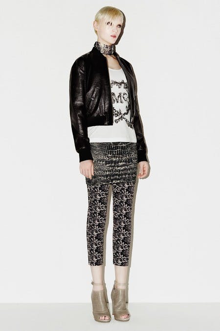 	The choker, sheer t-shirt, leather jacket, and printed leggings all combine for a classic rocker-chic look.