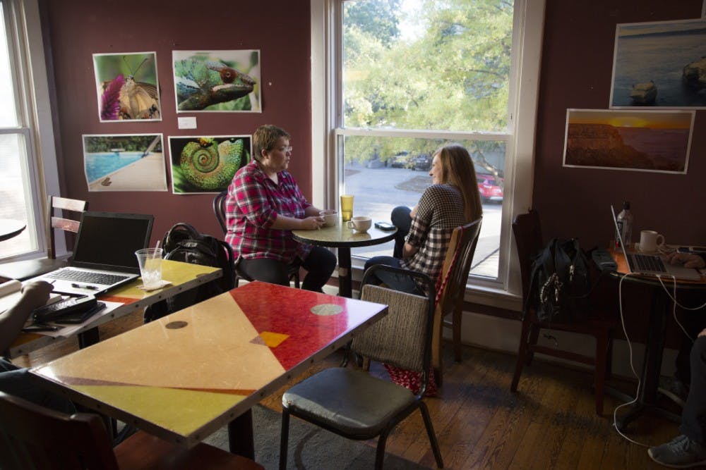 <p>Kathy Seppamaki and Rachel Rizzuti enjoy coffee at Cool Beans.&nbsp;</p>