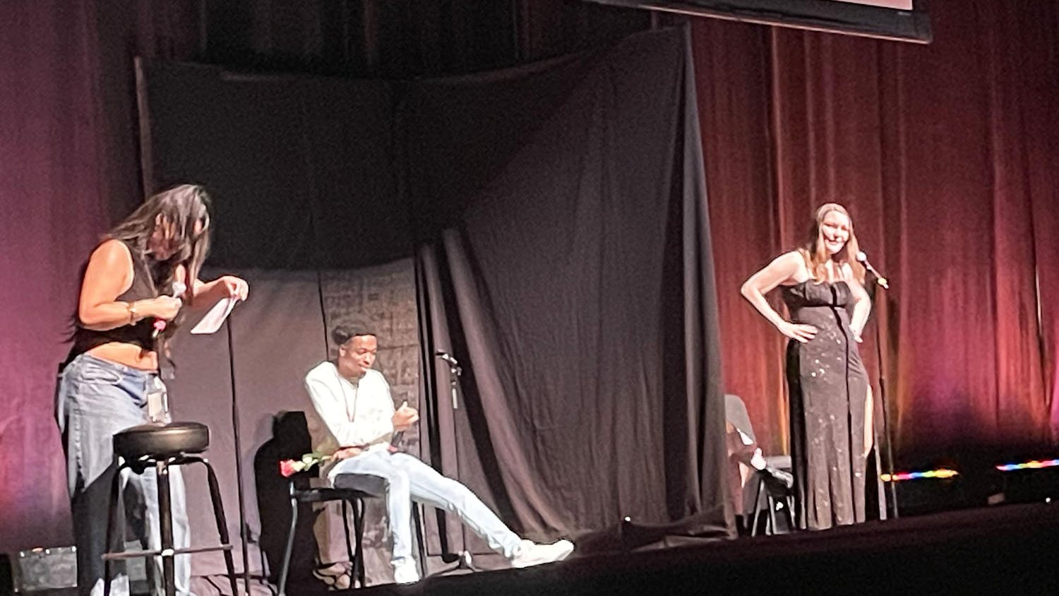 Dating game host Drew Afualo, speaks with the contestants at Koger Center on Jan. 29, 2024. Each round has one bachelor or bachelorette where they choose between three contestants based on the way they answer their questions.