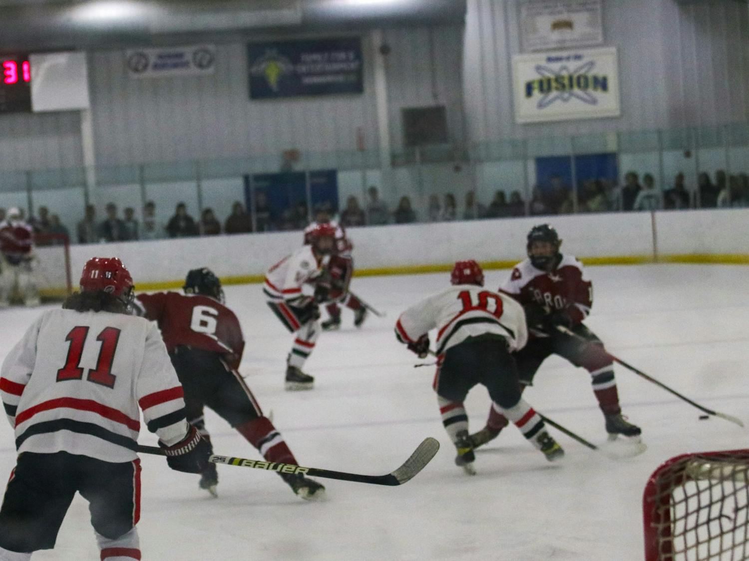 The South Carolina Cock Hockey players attempt to power past Georgia defenders during a match against the Georgia hockey team on Sept. 23, 2022. South Carolina defeated Georgia 3-1. 