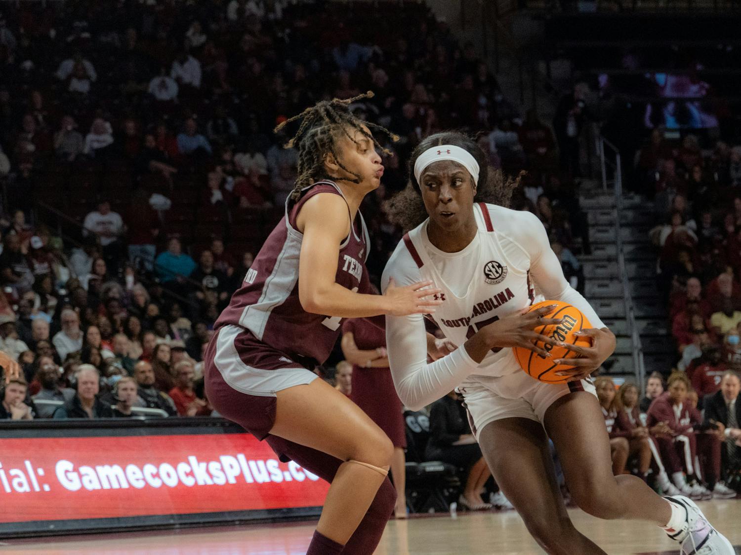 Senior forward Laeticia Amihere powers past a Texas A&amp;M player on her way to a basket during a Thursday night game on Dec. 29, 2022 at Colonial Life Arena. Amihere finished the game with 7 points.