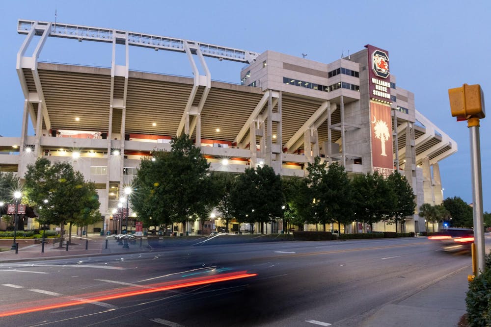 <p>The outside of Williams-Brice Stadium with cars passing by on Sept. 9, 2024. During the last game, Student Government gave out free water bottles and offered Uber discounts.</p>