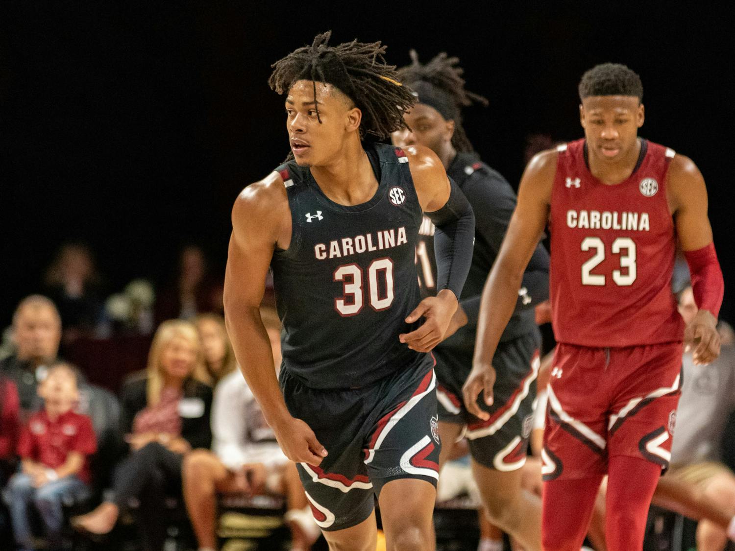 Freshman forward Daniel Hankins-Sanford runs back down the court to play defense after making a three-pointer during an intrateam scrimmage on Oct. 26, 2022. The men's basketball team hosted the Garnet &amp; Black Madness event.