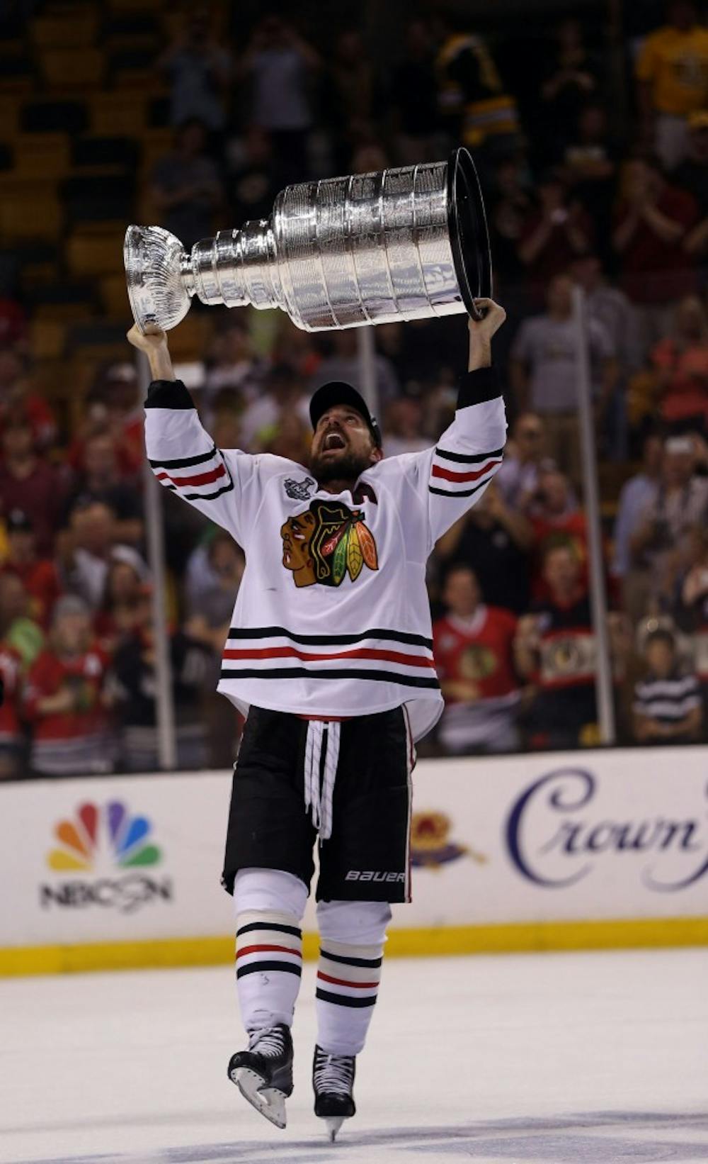 Blackhawks center Patrick Sharp lifts the trophy after Chicago defeated the Boston Bruins, 3-2, to win the Stanley Cup at TD Garden in Boston, Massachusetts, Monday, June 22, 2013. (Scott Strazzante/Chicago Tribune/MCT)