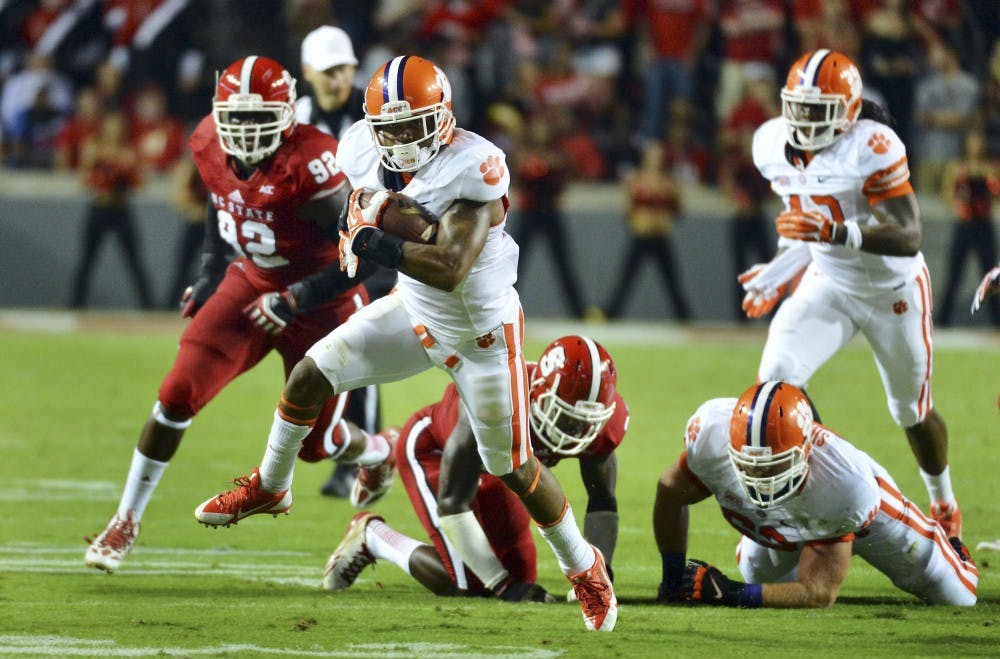 Clemson running back Roderick McDowell (25) breaks away from the North Carolina State defense for a first down in the first half on Thursday, September 19, 2013, at Carter-Finley Stadium in Raleigh, North Carolina. Clemson won, 26-14. (Chuck Liddy/Raleigh News &amp; Observer/MCT)